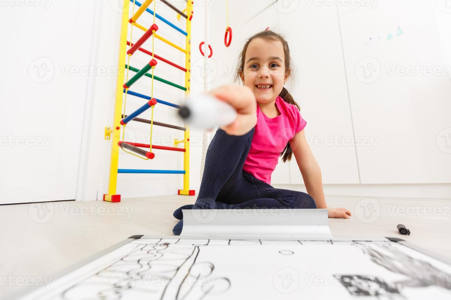 Little girl drawing - closeup shot photo