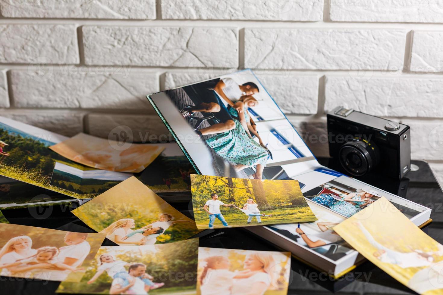 Frame with old paper and photos. Objects over wooden planks photo