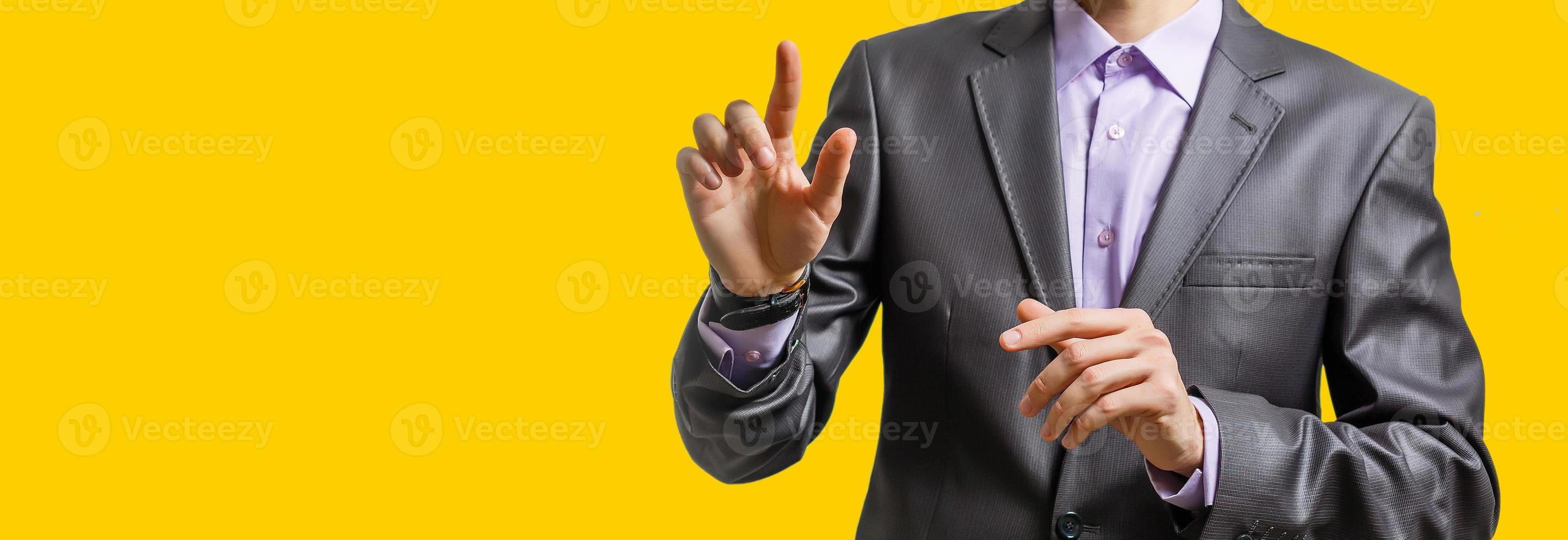 Businessman hand touching map point, network connection, international meaning, copy space yellow background photo