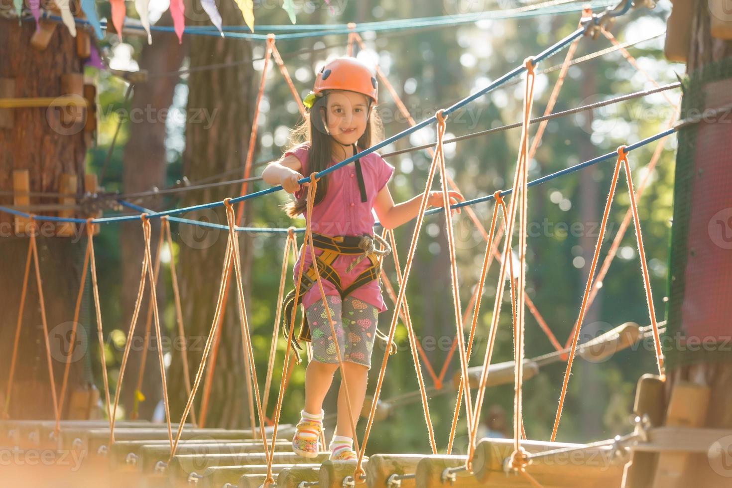 little girl getting ready for climbing photo