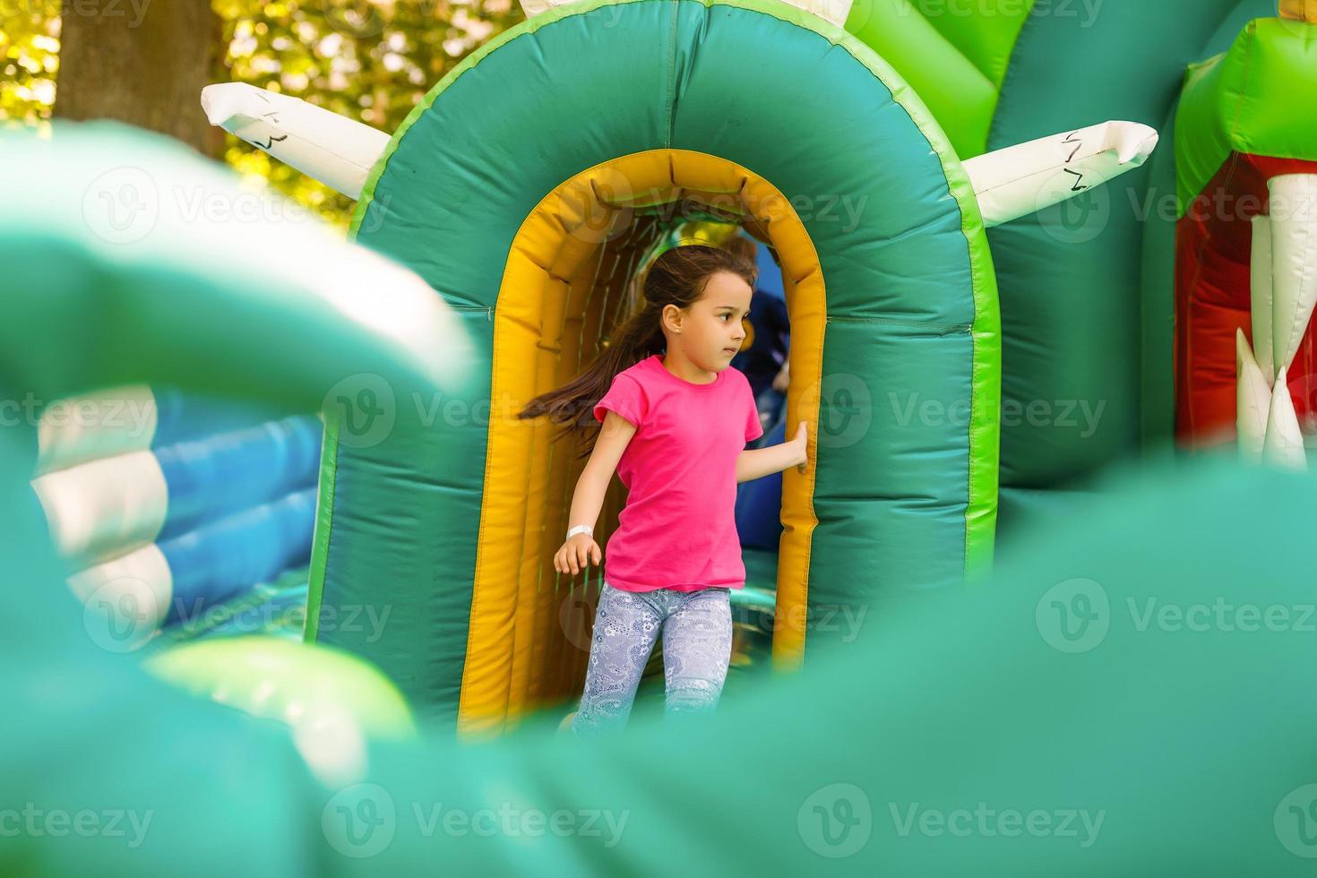 Cute little girl in amusement park photo