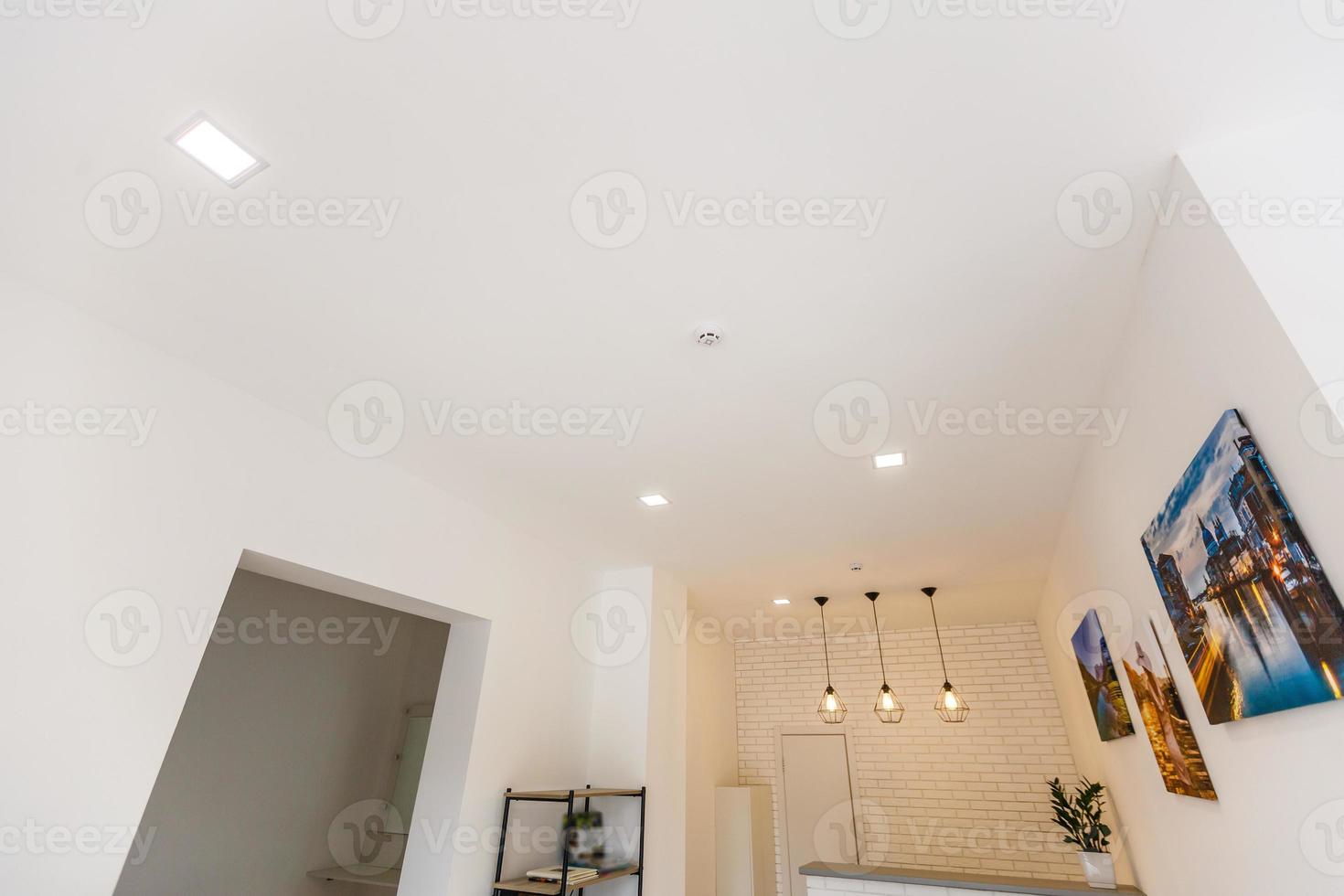 White ceiling with spot lights in room photo