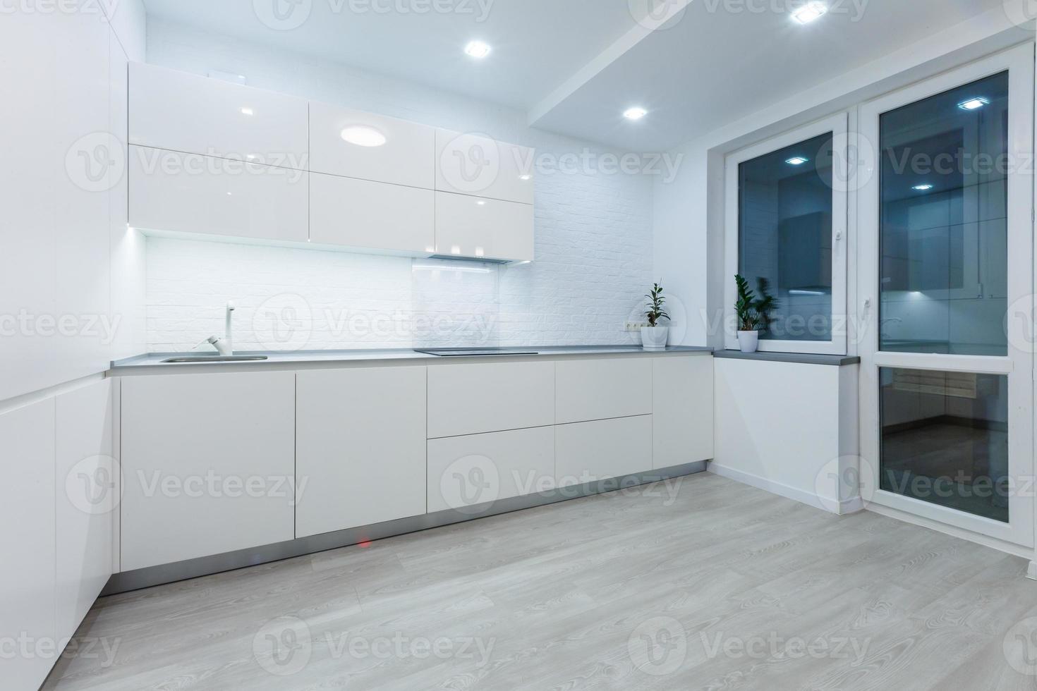 interior design of clean modern white kitchen photo
