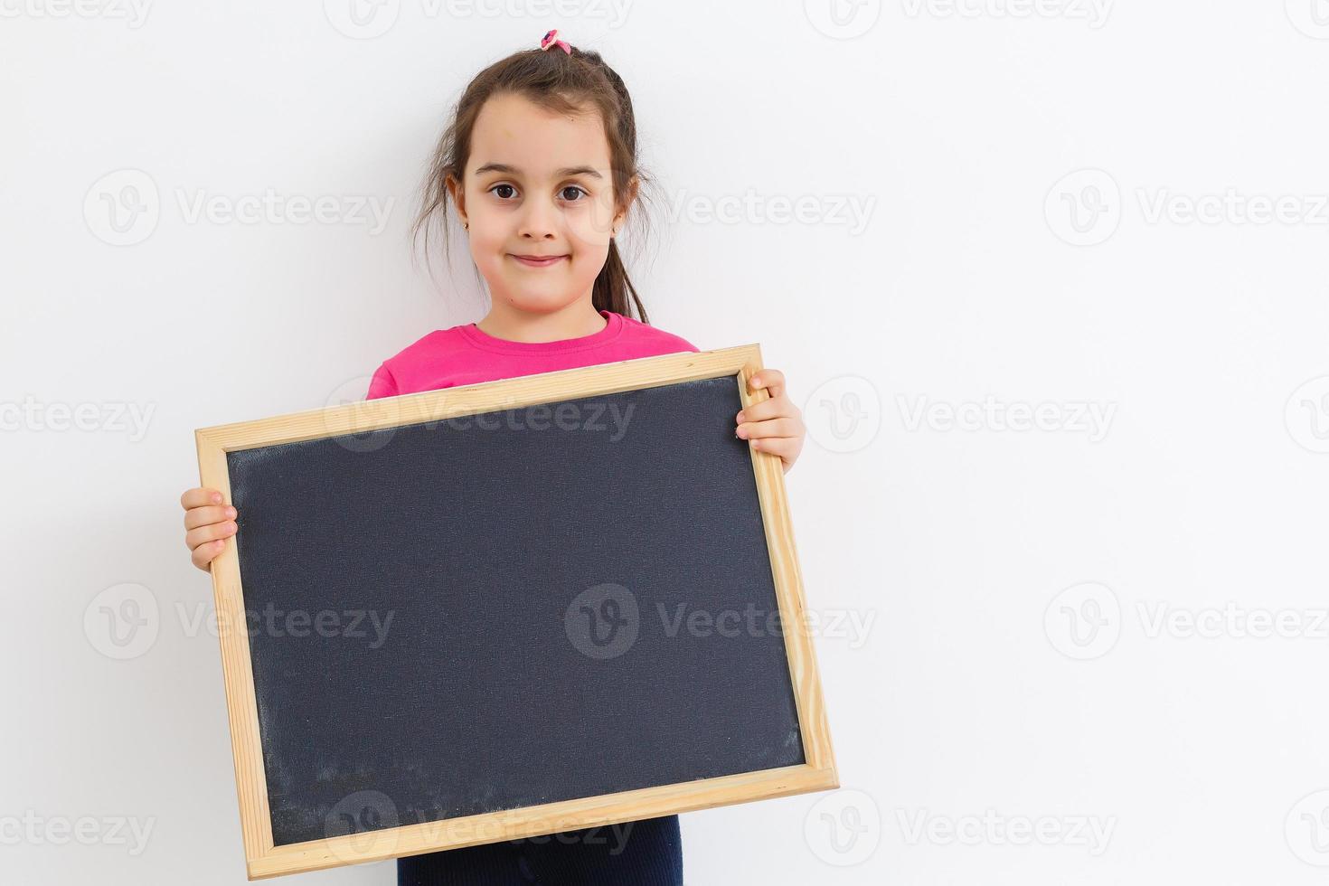 little girl holding a board photo