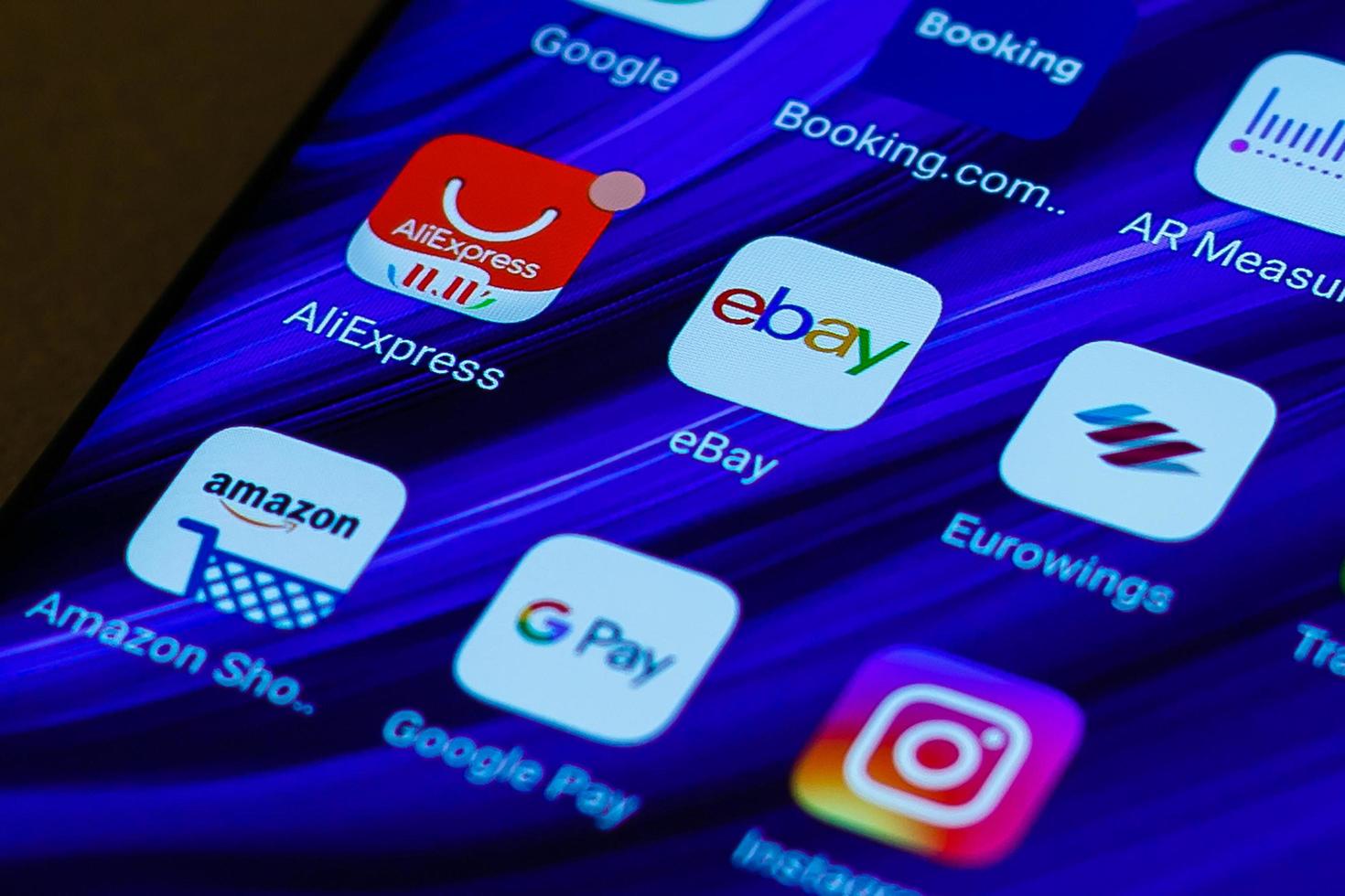 eBay, Amazon, AliExpress and Alibaba apps icon on the screen smartphone. Closeup mobile applications for shopping, e-commerce. Kyiv, Ukraine - November 10, 2019 photo