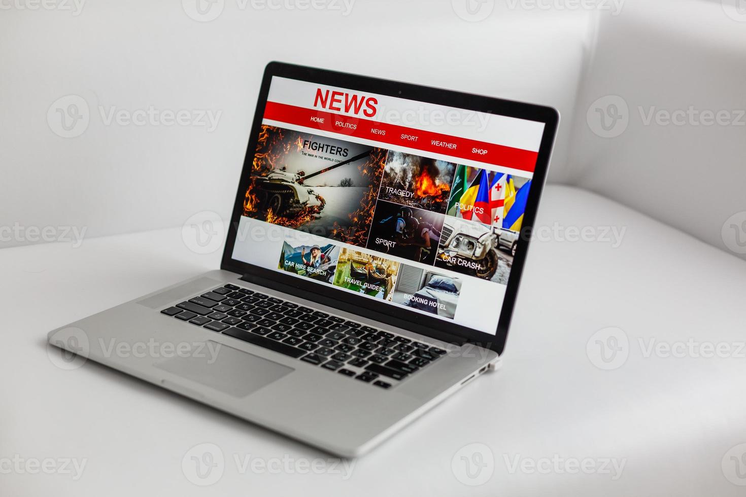 Cropped image of businessman reading news on laptop at office desk photo