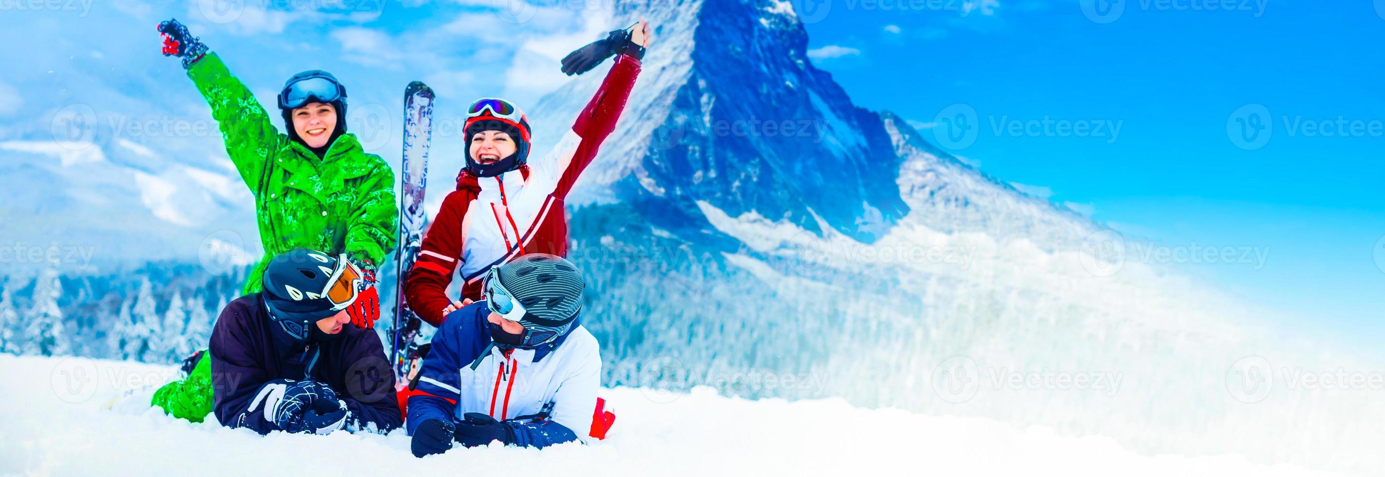 Skiing family enjoying winter vacation on snow in sunny cold day in mountains and fun. Switzerland, Alps. Composite photo. photo