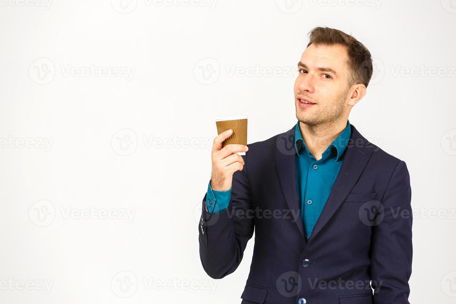 Portrait of chic handsome pleased delightful serious attractive dreamy wealthy elegant classy man smelling the aroma of fresh bitter coffee isolated on gray background copy-space photo