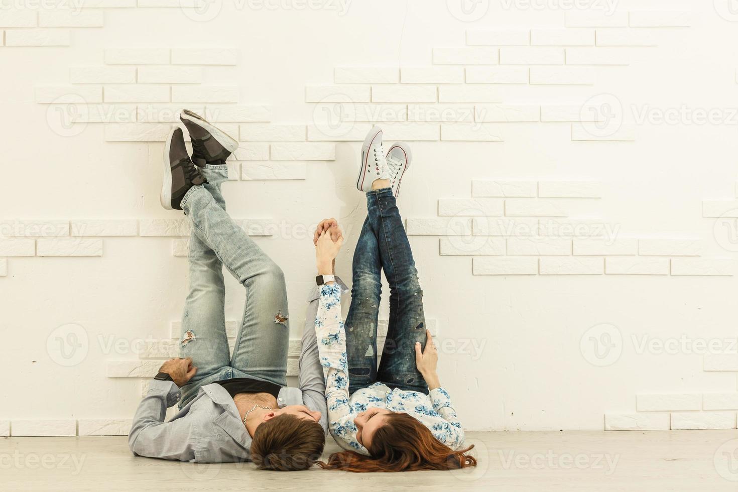 repair, building, renovation and home concept - smiling couple looking at tablet pc at home photo