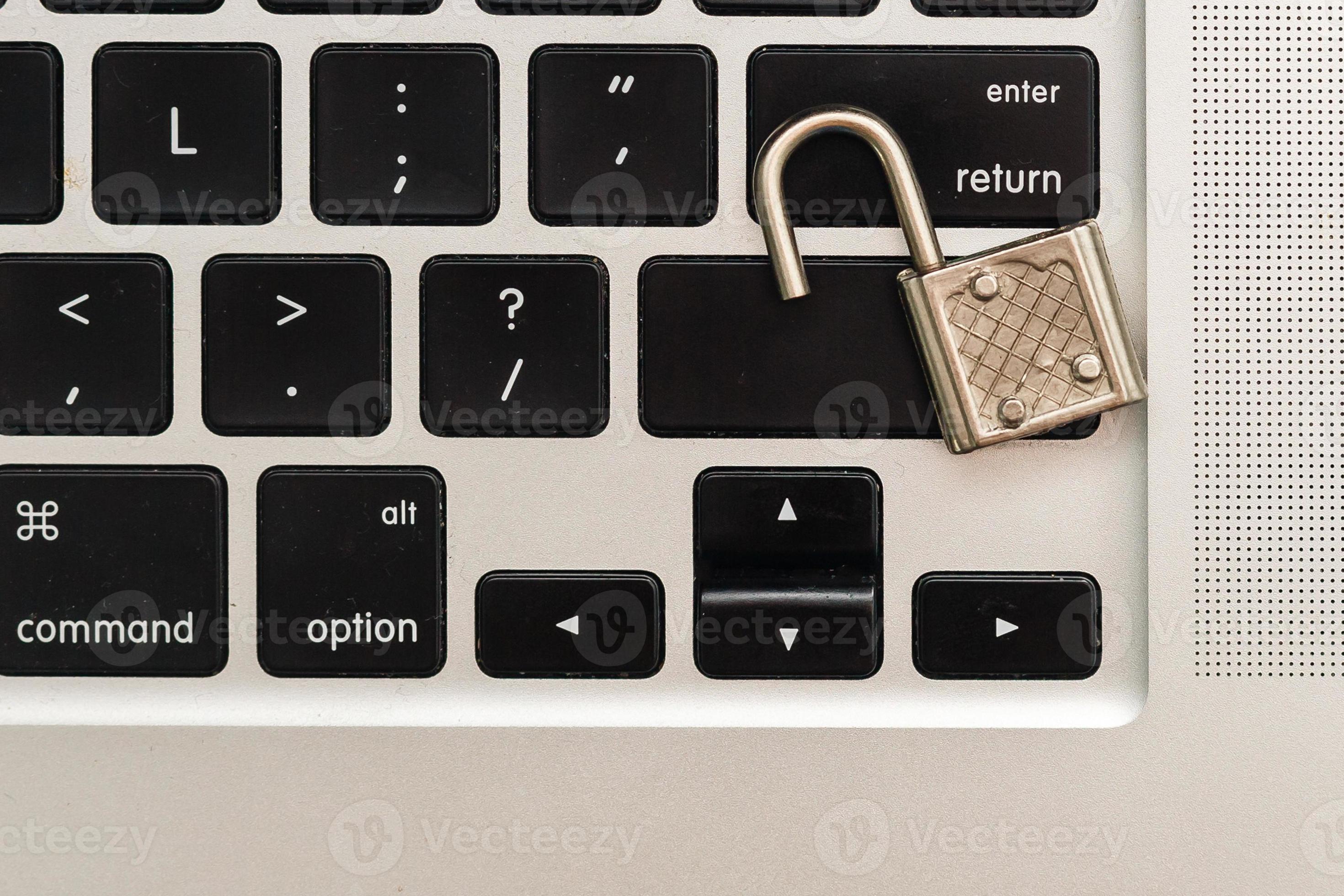 Cyber safety concept, locked and key on laptop computer keyboard ,key
