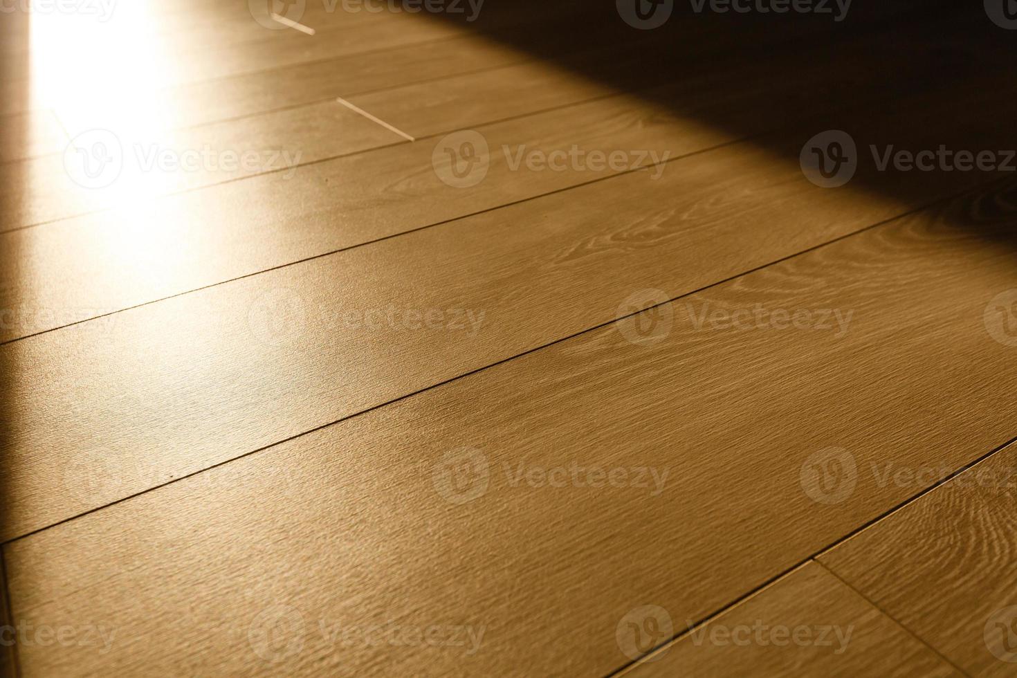 Light and shadow on laminate floor from window. Sunlight. Abstract background. Top view. photo