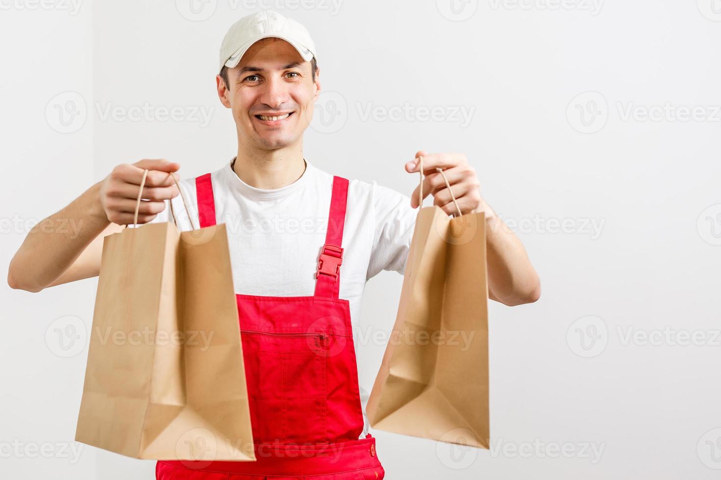 paper containers for takeaway food. Delivery man is carrying photo