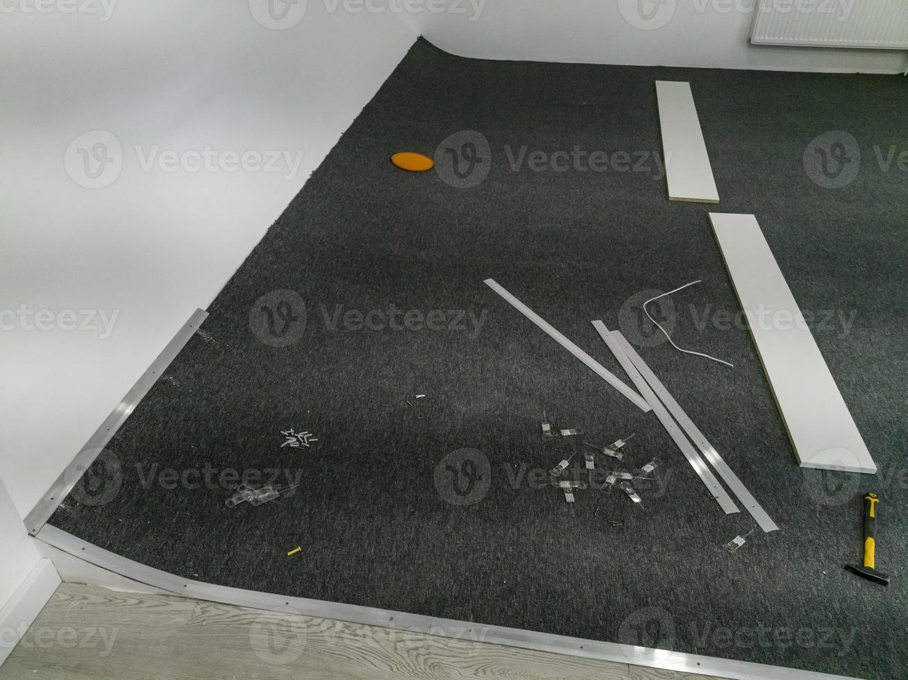 Work tools for laying carpet - laying flooring photo