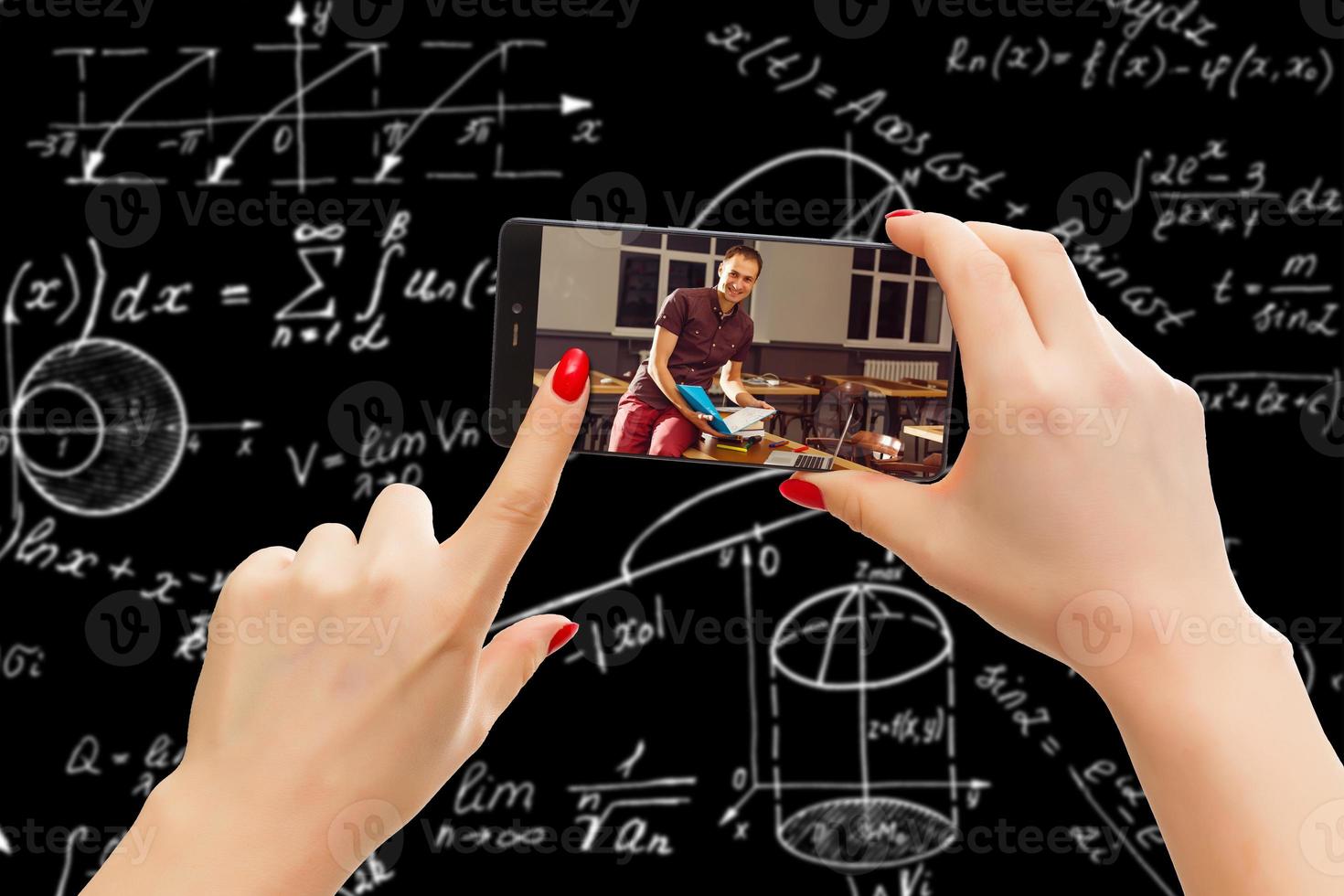 Man use mobile phone, blur image classroom as background. photo