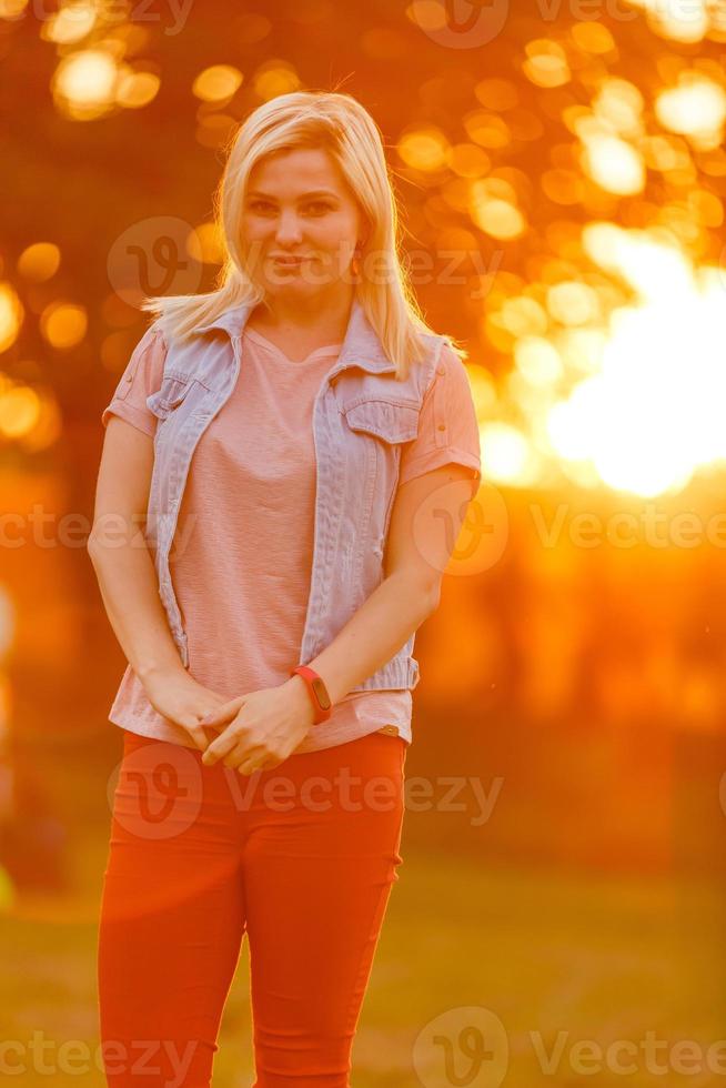 Cute lady walking through the meadow photo