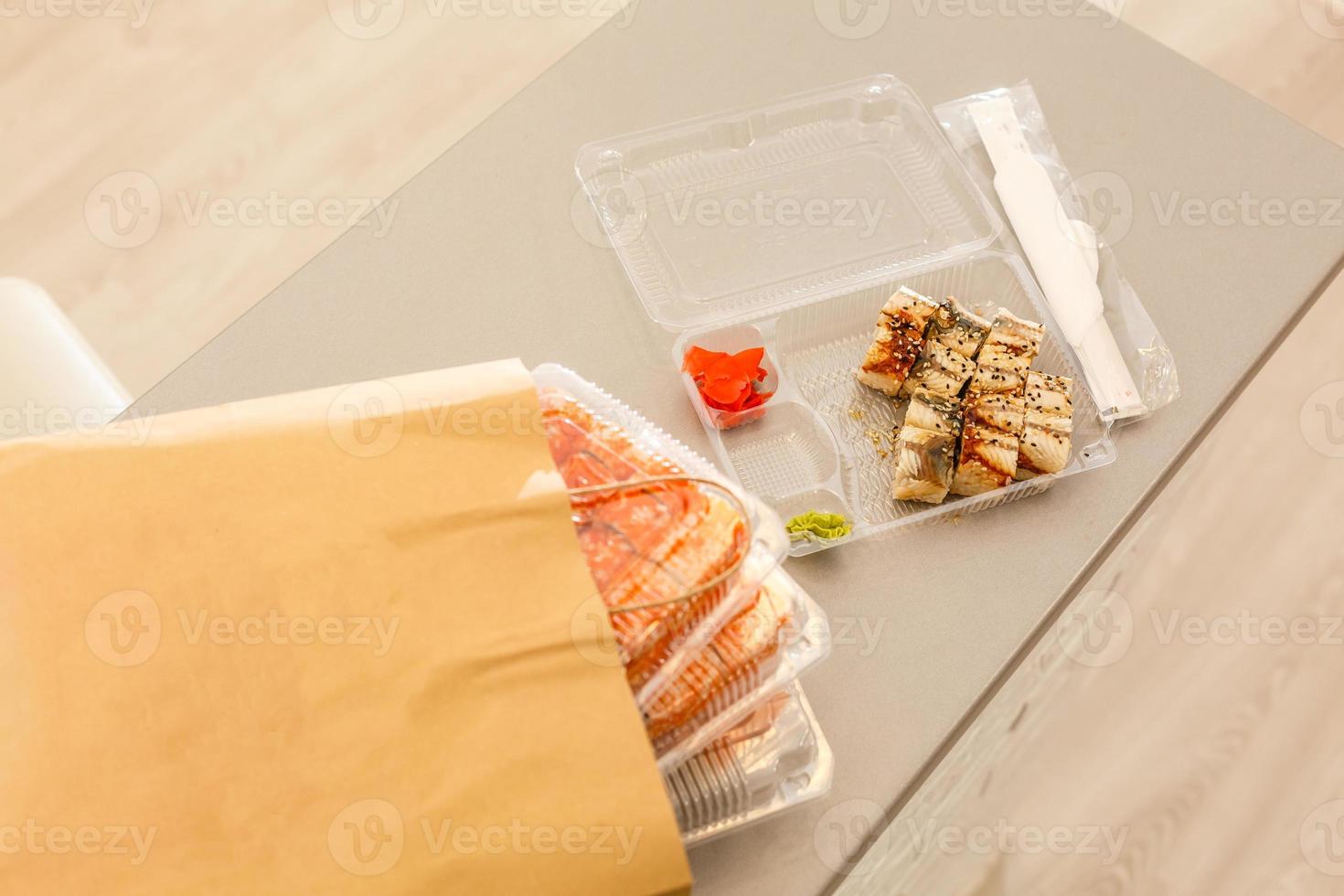 Take-Out Makizushi Meal, California, Shrimp Tempura, and Tuna Rolls, with Soy Sauce, Pickled Ginger, and Miso soup. photo