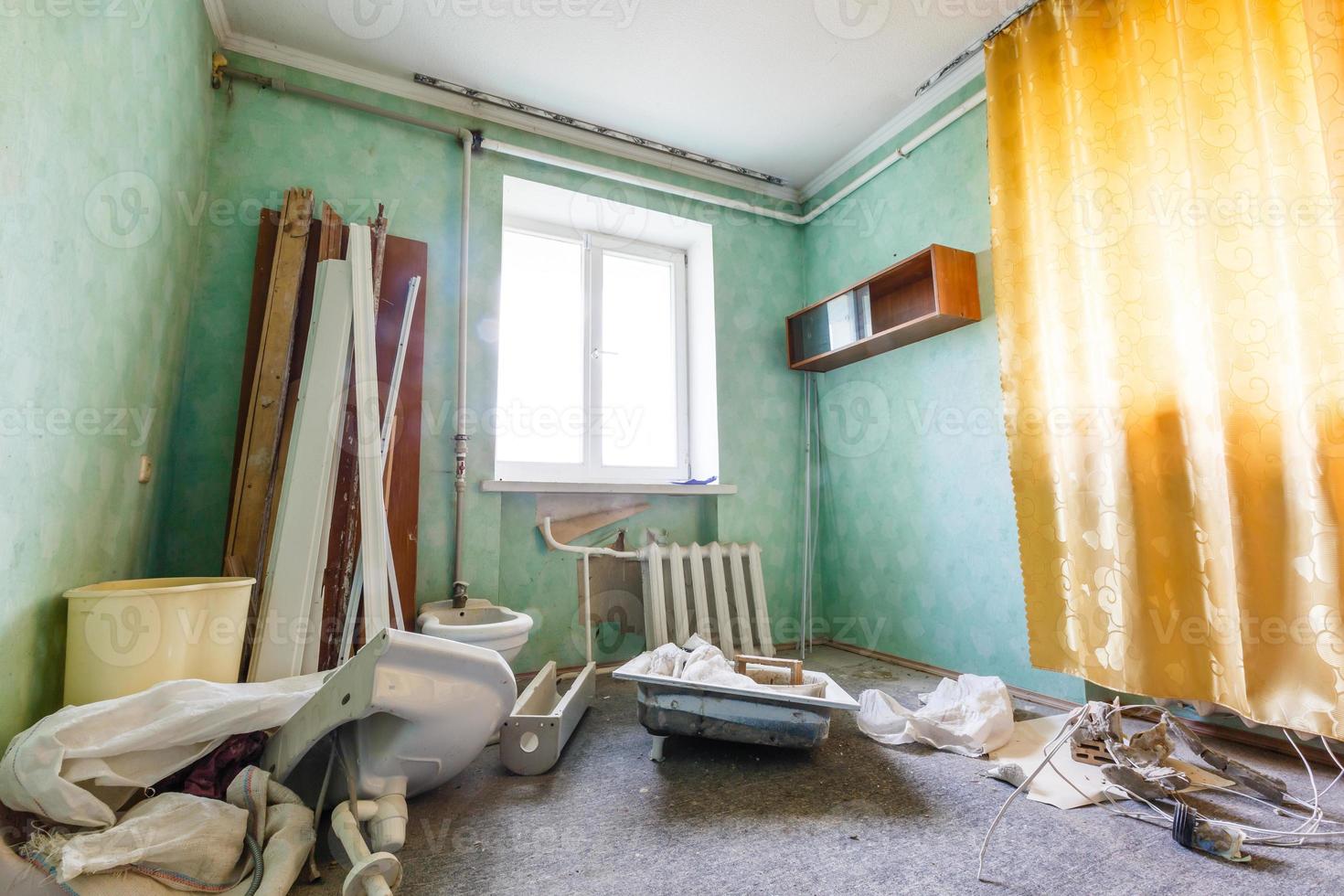 Devastated kitchen in a demolition house photo