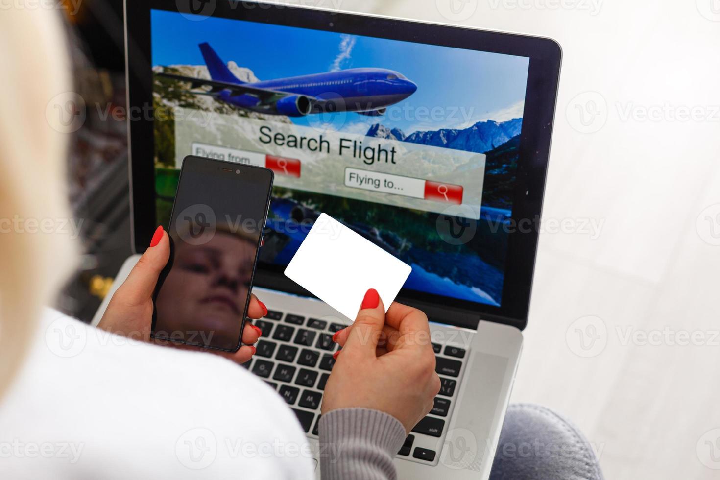 flight search on internet website, travel planning concept, airplane tickets online photo
