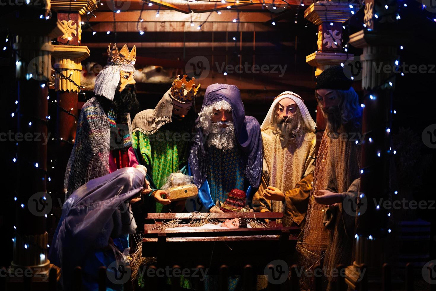 The scene where the Virgin Mary gave birth to Jesus and he lies in the cradle surrounded by people who have come to celebrate the Nativity of Christ. photo