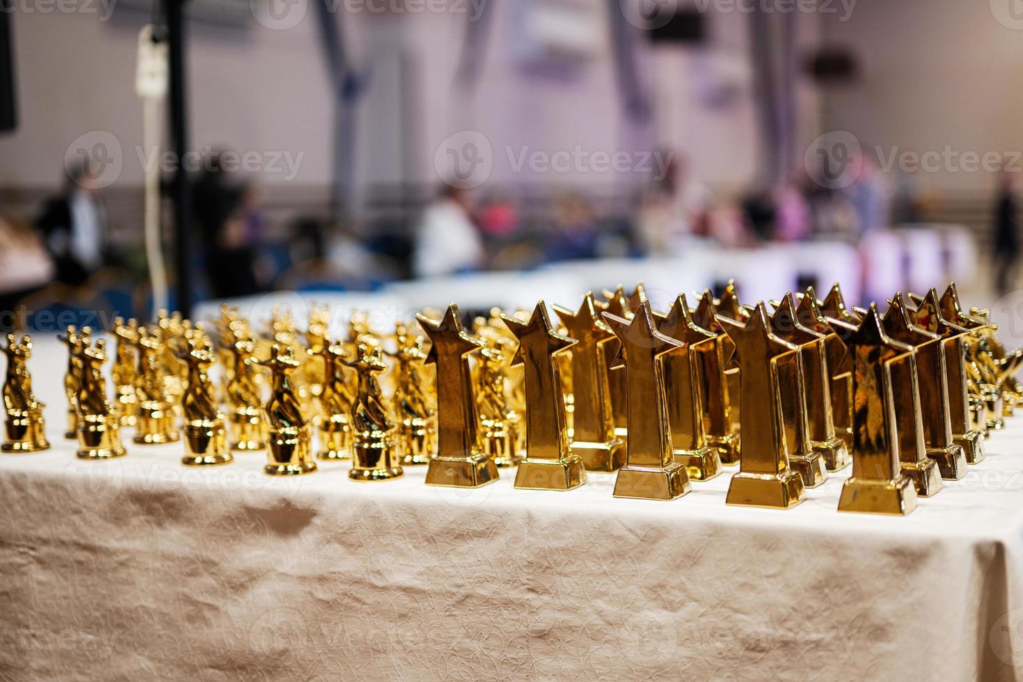 Award and victory concept. Row of golden cups of dance competition. photo