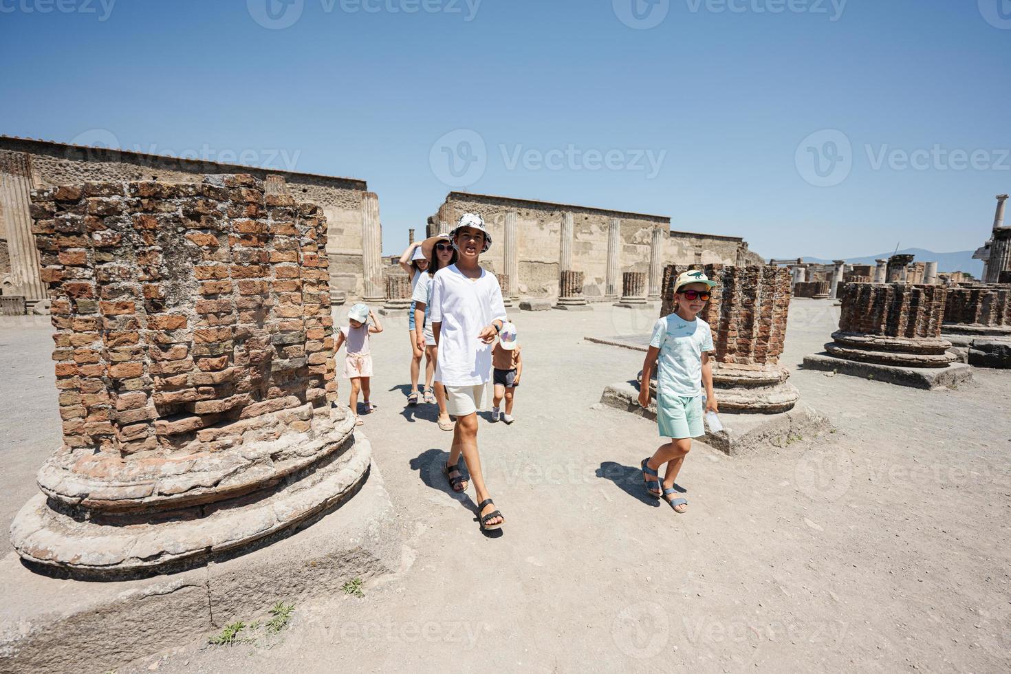 Family tourist walking at Pompeii ancient city, Italy. photo