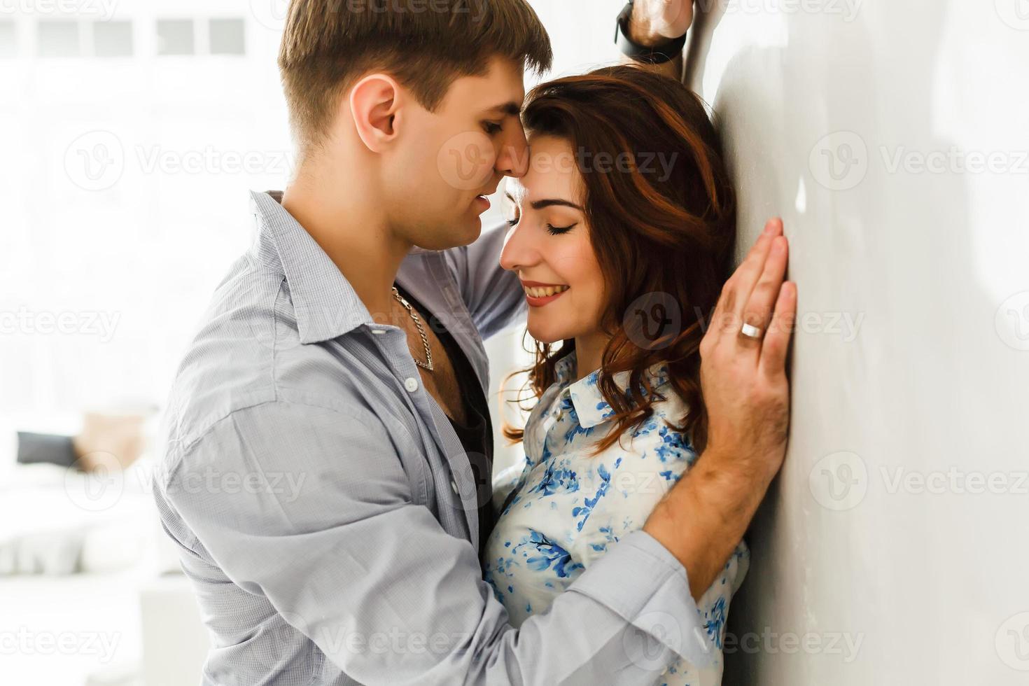Young couple in love on the bed in the moonlit night photo
