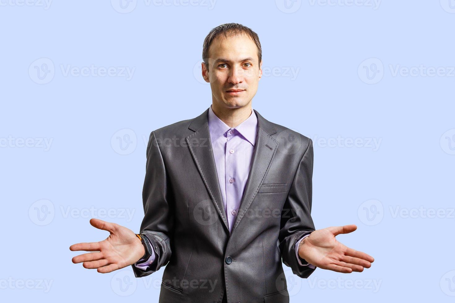 the businessman at a gray wall photo