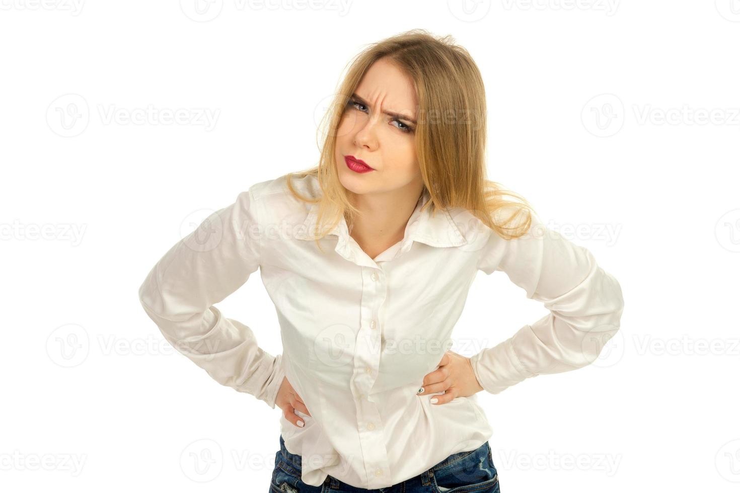 woman looking at the camera with his hands on waist photo