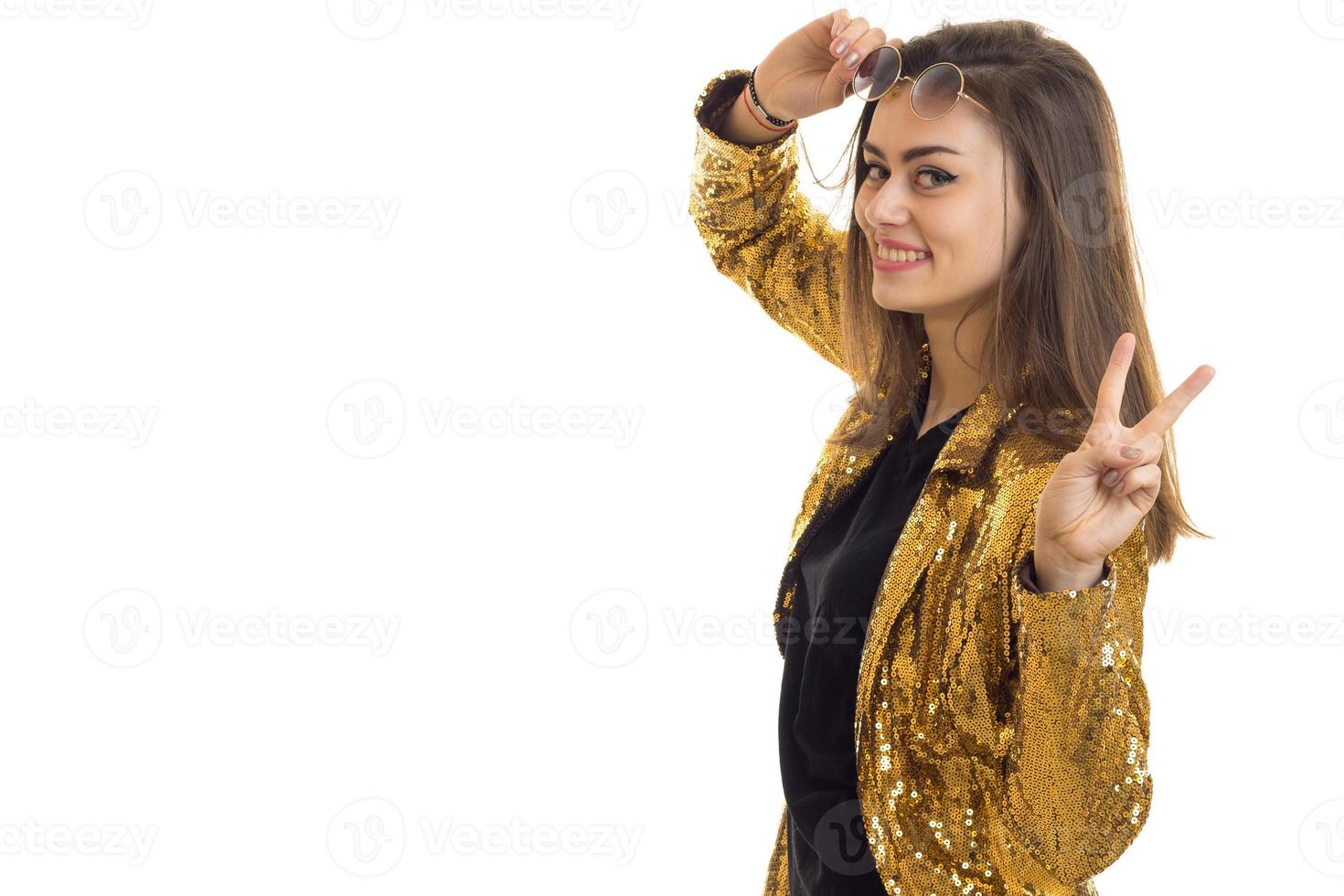 portrait of stylish charming woman in golden jacket photo