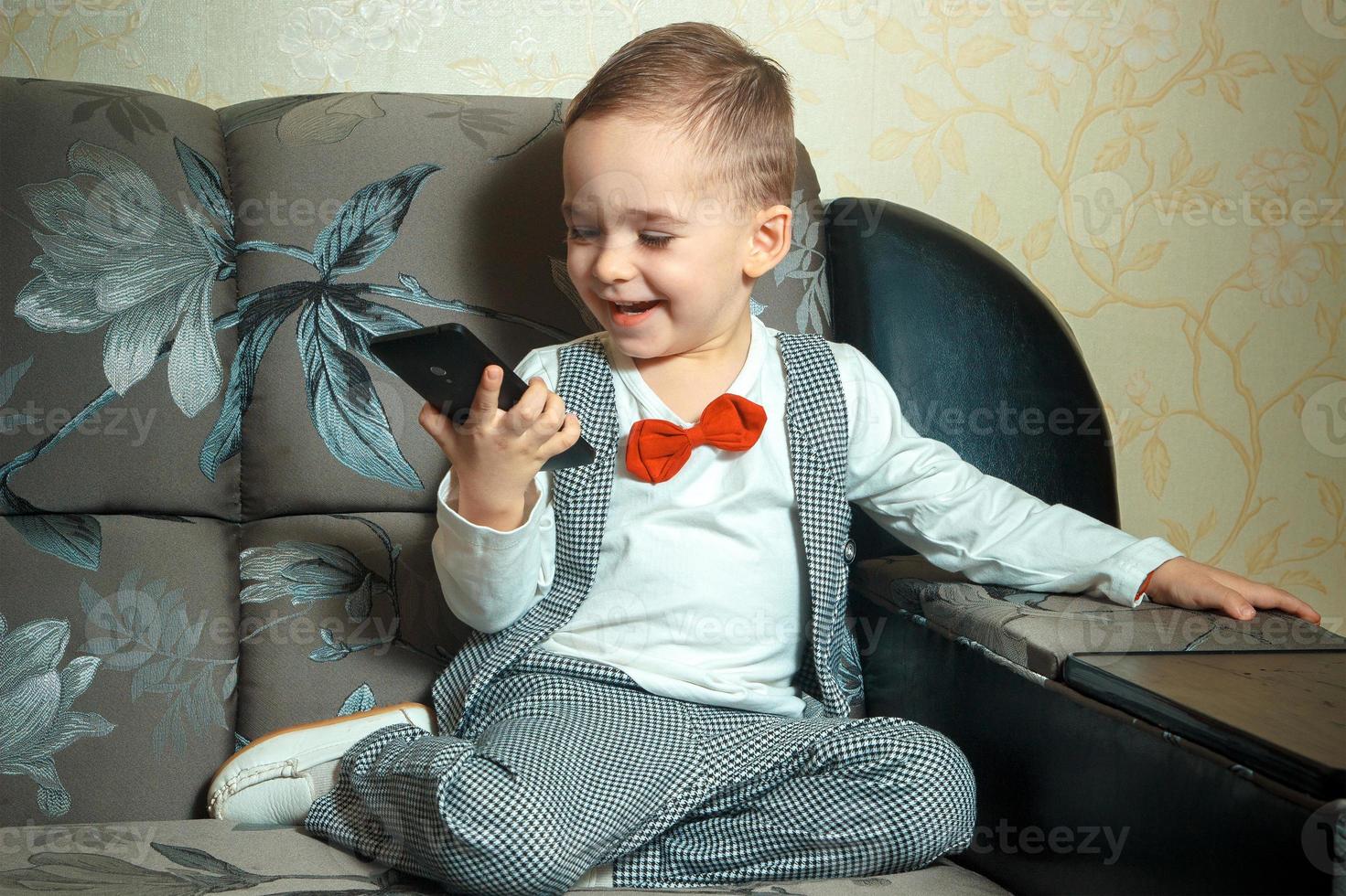 happy boy with mobile phone photo