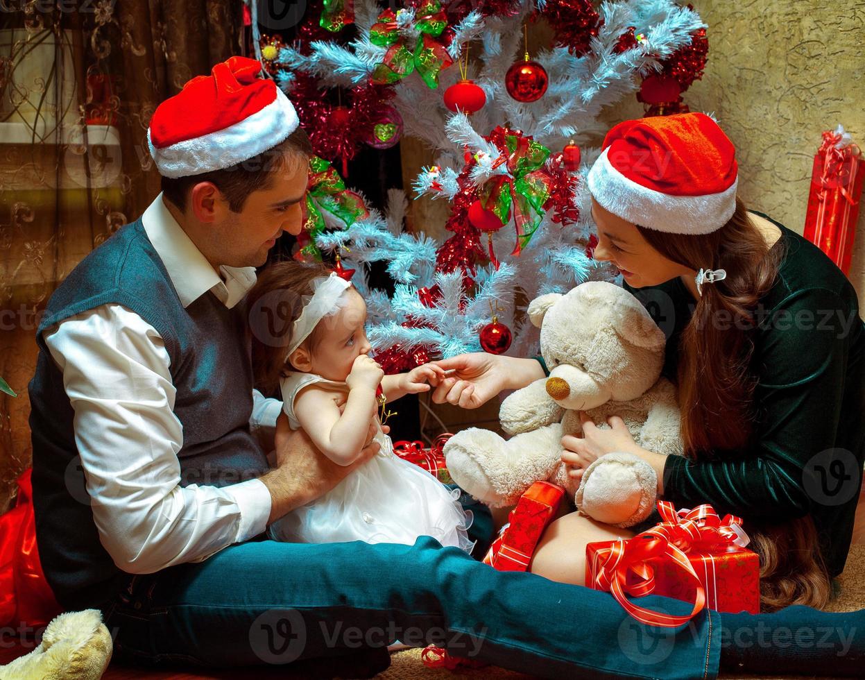 Christmas family with little baby girl photo