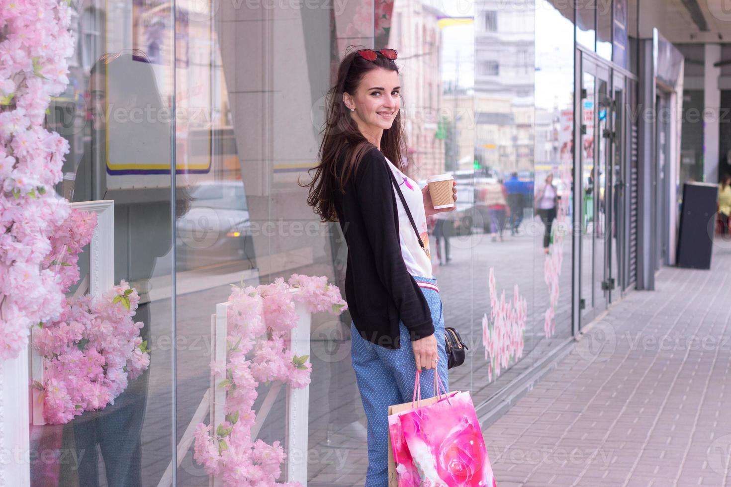 sweet charming lady near urban shops worth with packages photo