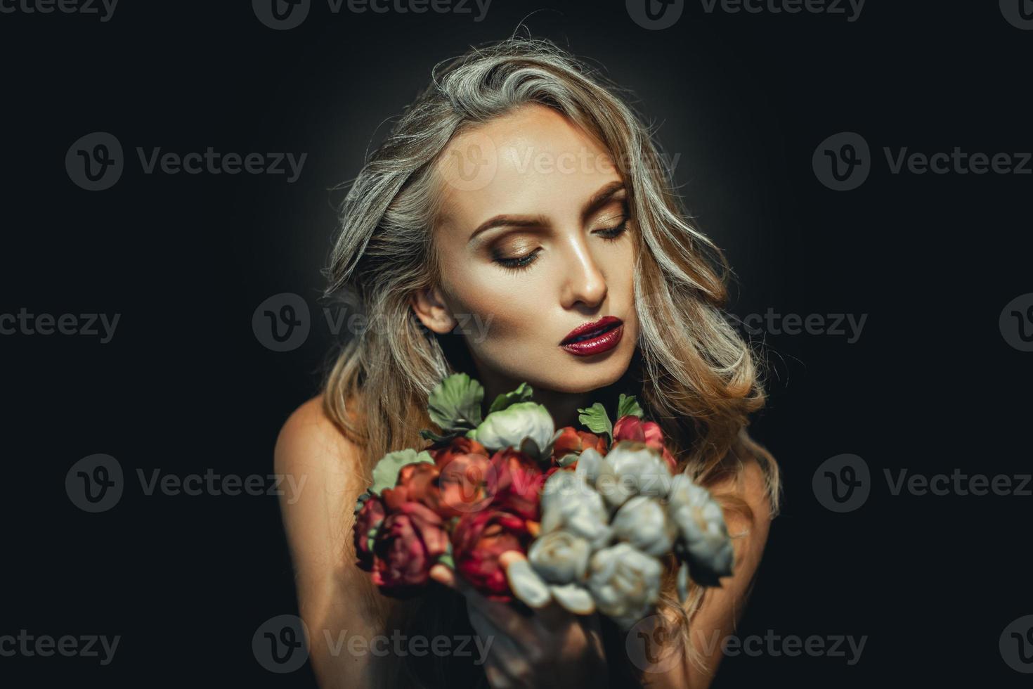 Adorable woman with beautiful makeup and flowers photo