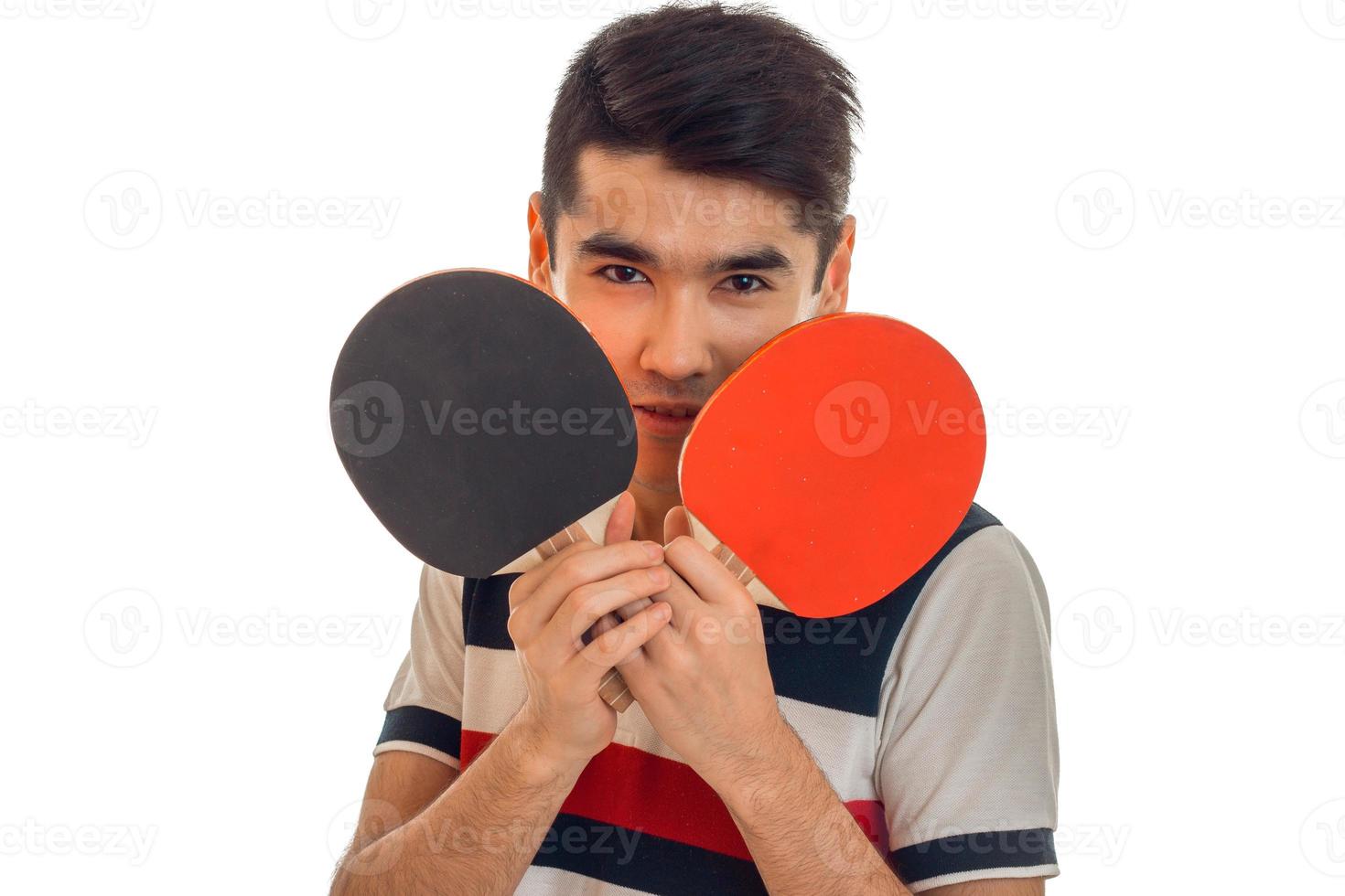 young sports man playing ping-pong isolated on white background photo