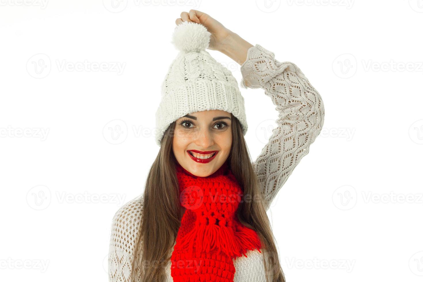 brunette girl in warm sweater and red scarf photo