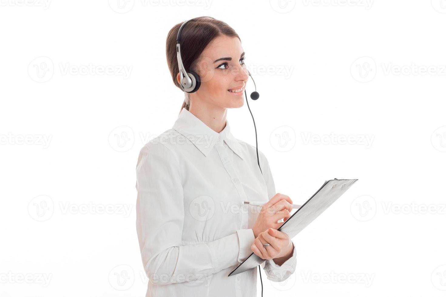 horizontal portrait of young attractive call office worker girl with headphones and microphone isolated on white background photo