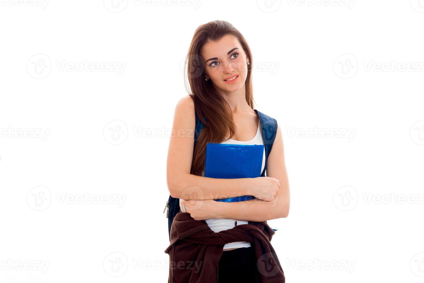 young girl holding a folder with papers and looks toward isolated on white background photo