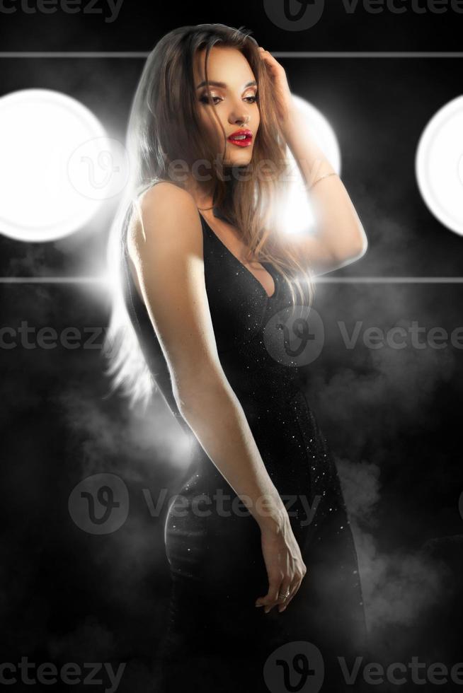 young glamour lady wuth red lips in black tight suit looking aside photo