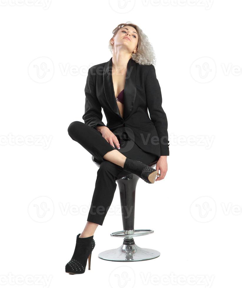 business girl posing on chair photo