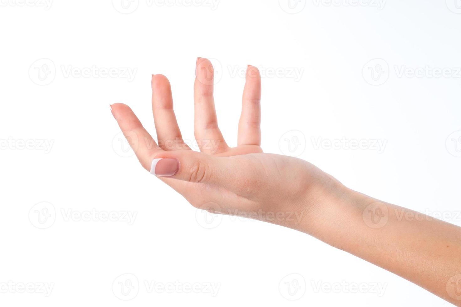 mano de mujer con un ladoneji hacia arriba levantó los dedos aislado sobre fondo blanco foto
