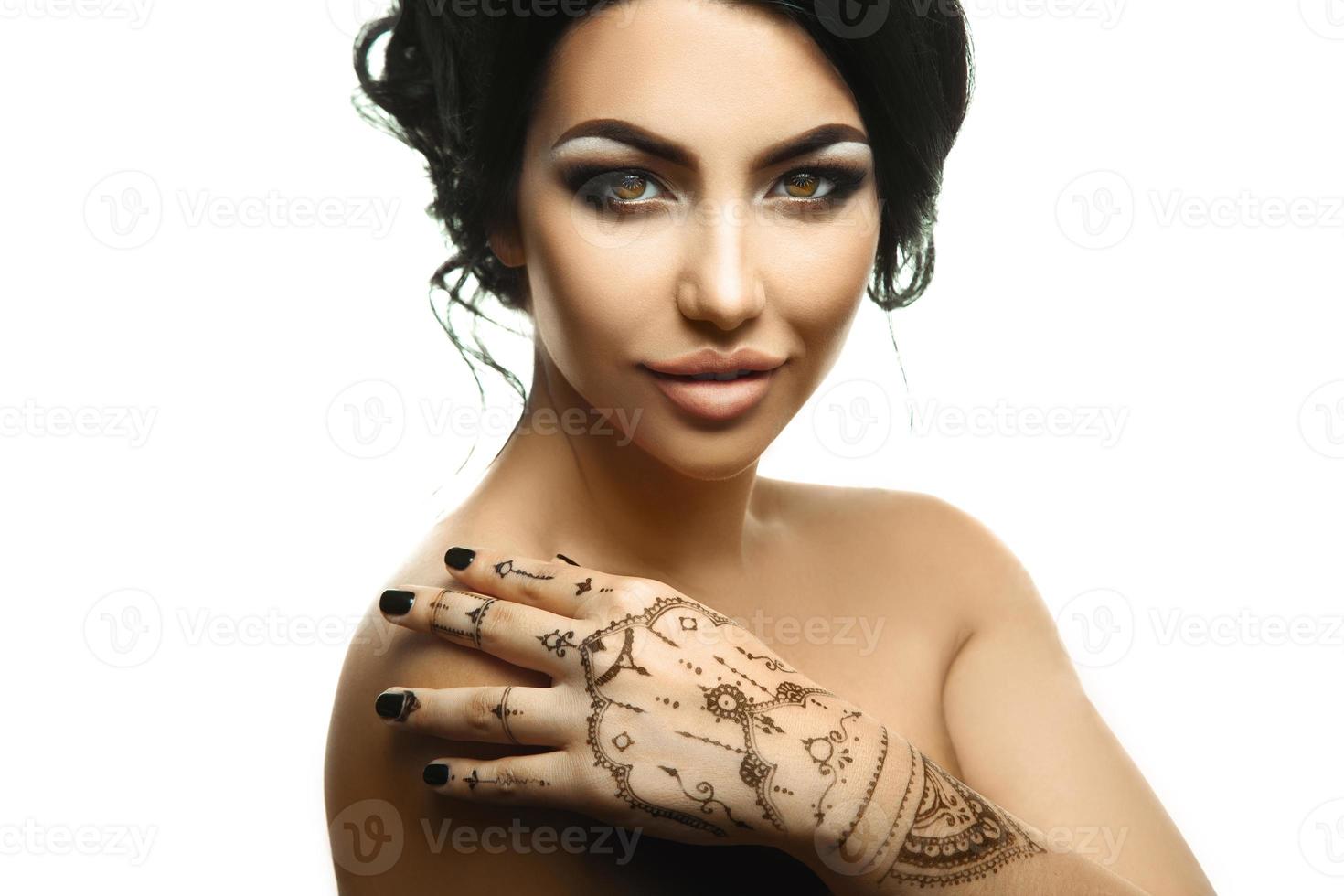 Sensual girl with beautiful makeup looking at camera photo