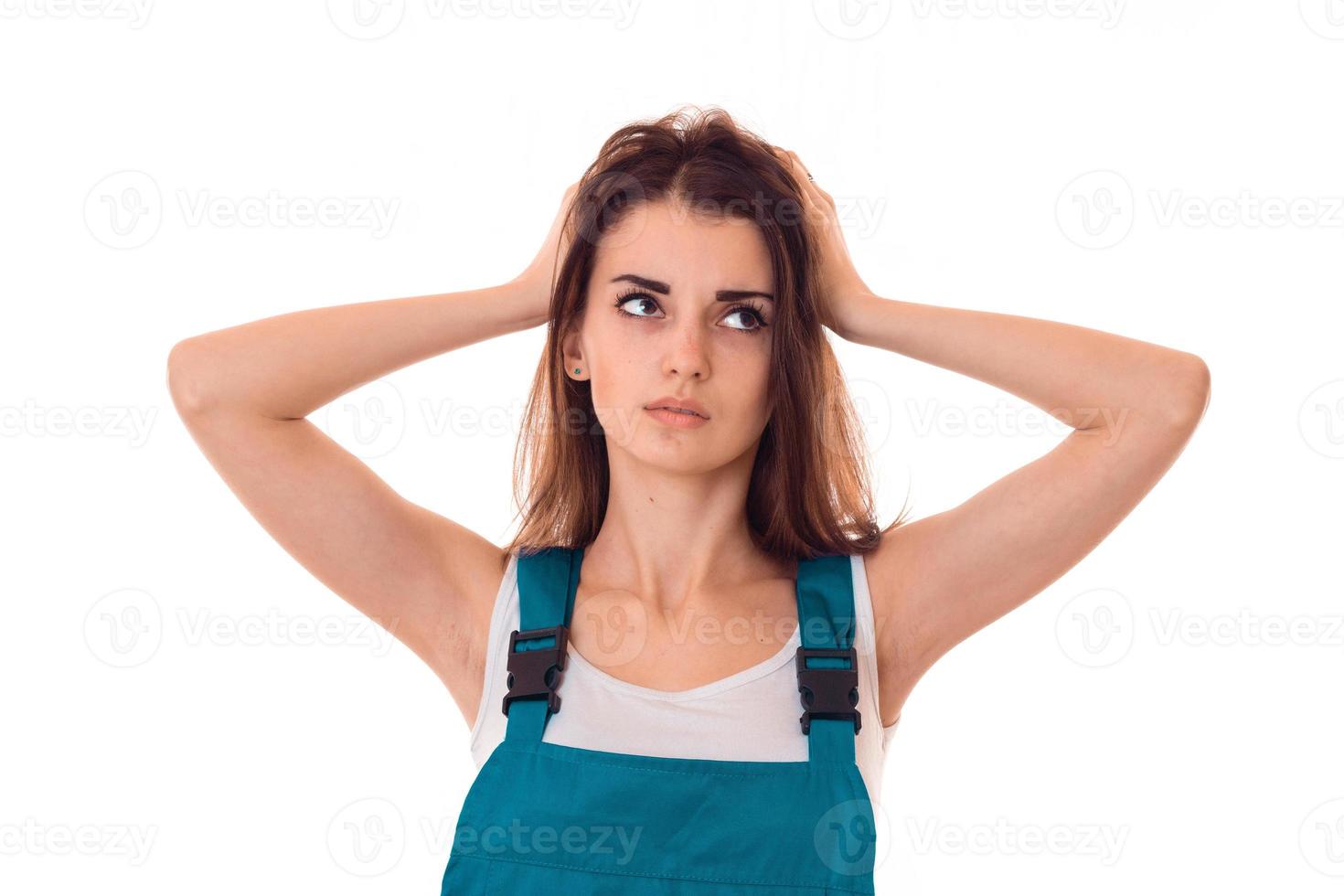 a young girl looks away and kept her hands behind his head close-up photo