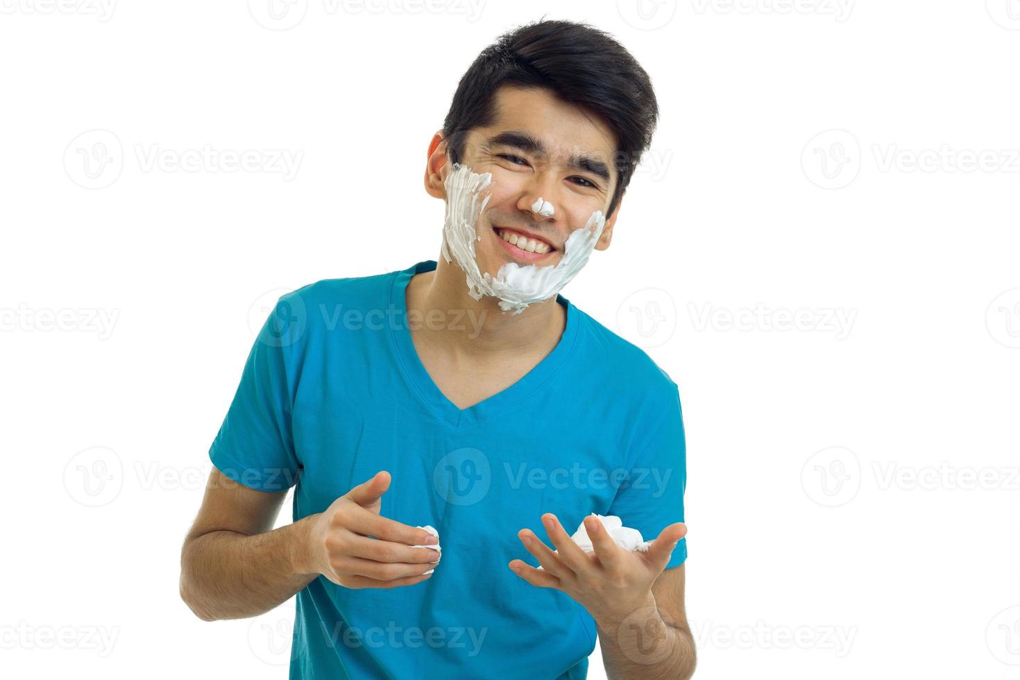 Portrait of a cheerful guy with beard foam isolated on a white background photo