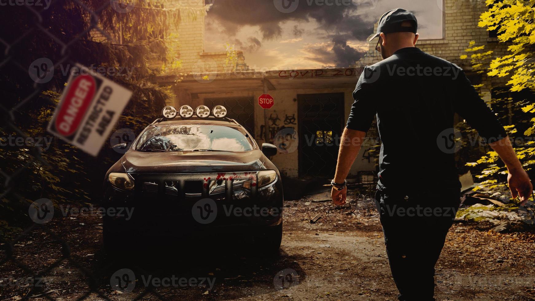 the last man on earth stands near an abandoned car after the virus pandemic. Hazard warning signs around the virus zone. photo