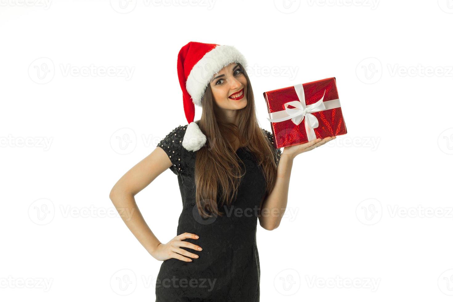 Charming Girl in santa hat smiling photo