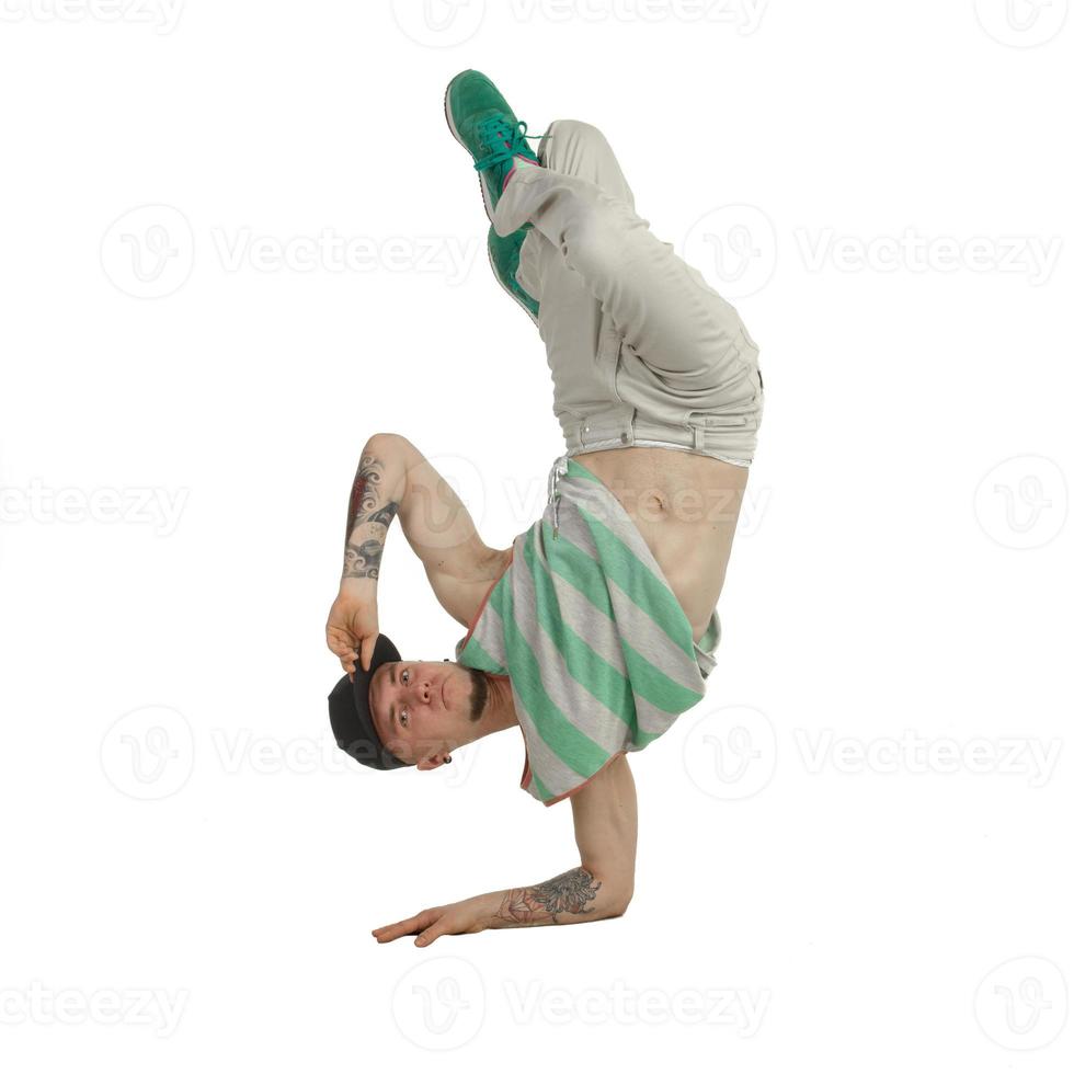 young man break dancer standing on one arm photo