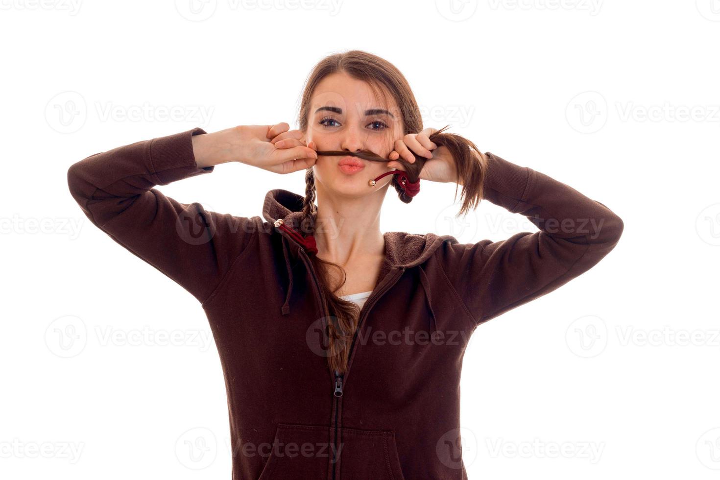 portrait of young funny student girl in brown sport clothes isolated on white background photo