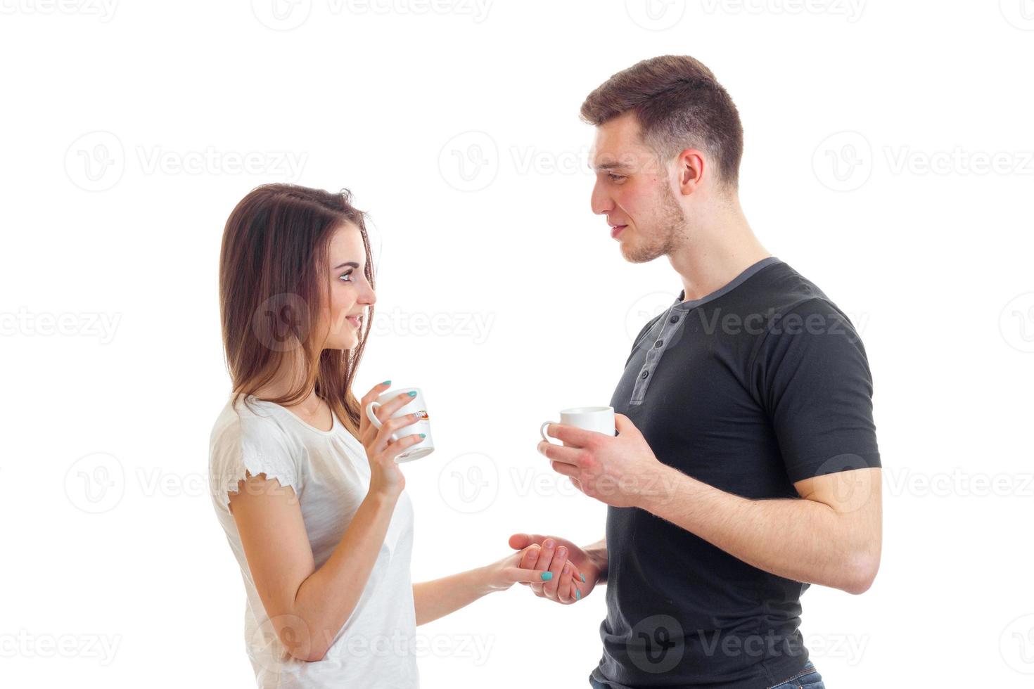 cute young couple drinking tea and watching each other photo