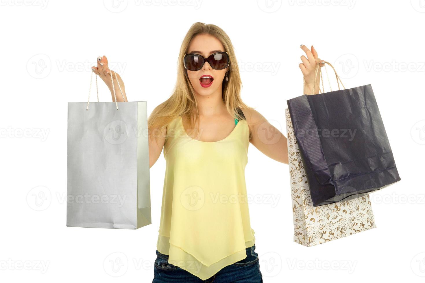 Beautiful girl posing with shopping bags photo