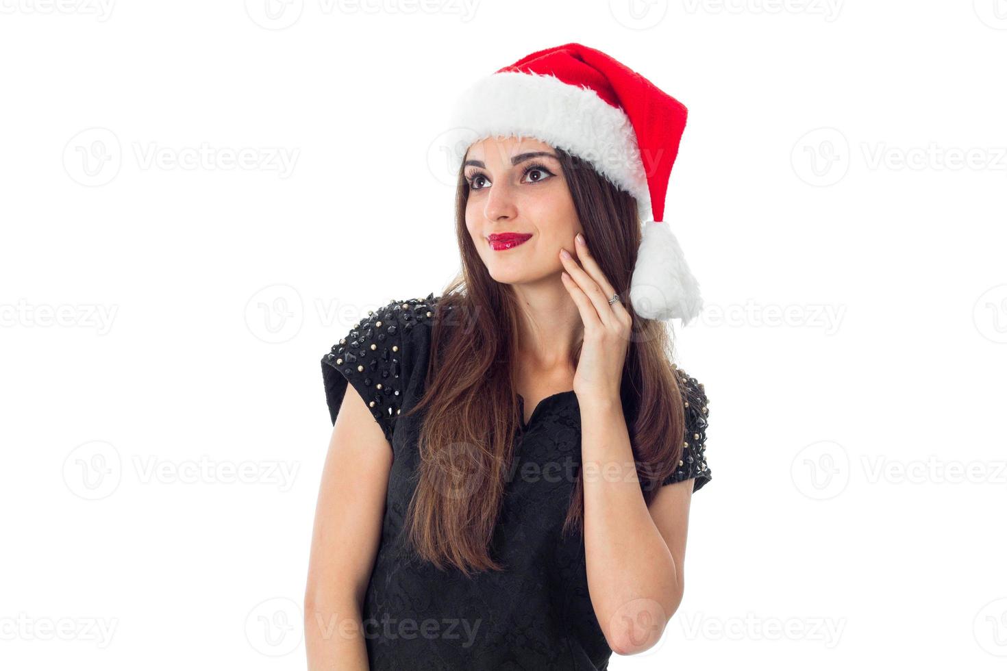 charming brunette girl in santa hat photo